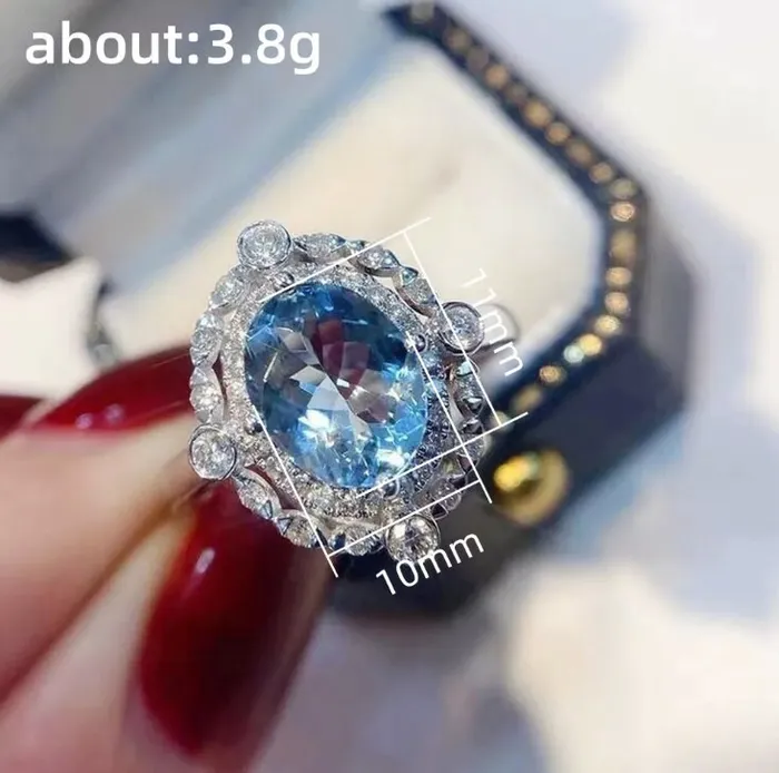 Minx London Rings Blue Diamond Engagement Ring Oval Wedding Ring Wedding Ring Blue Wedding Ring Halo Ring Beautiful engagement ring Wedding Ring